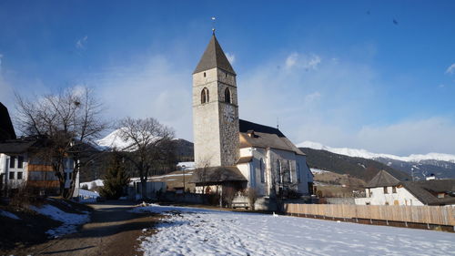 Building against sky during winter