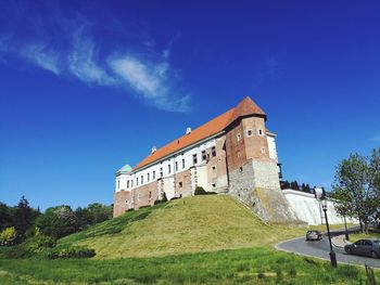 Low angle view of fort against blue sky