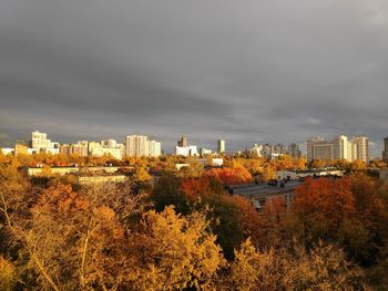 High angle view of trees and buildings against sky