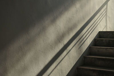 Shadow of railing on steps