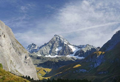 Scenic view of snowcapped mountains against sky