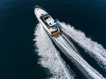 High angle view of ship sailing on sea