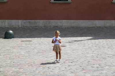 Full length of girl standing outdoors