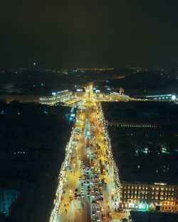 High angle view of illuminated city buildings at night