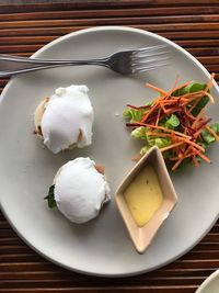 High angle view of food served in plate. egg benedict.