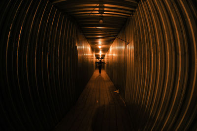 Rear view of man in tunnel