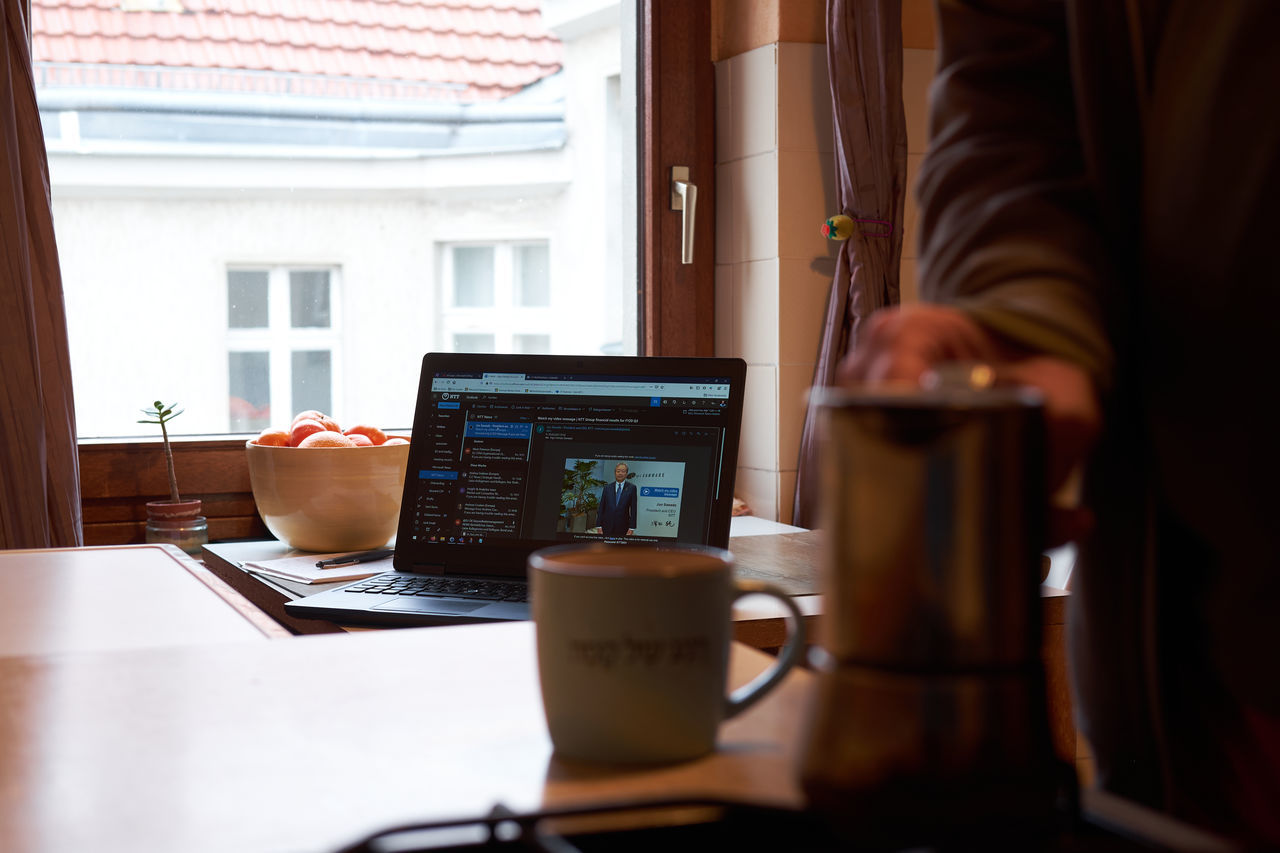 COFFEE CUP ON TABLE IN OFFICE