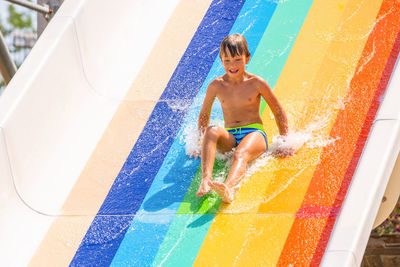 Full length of boy in swimming pool