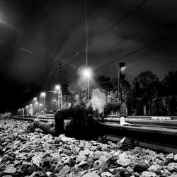 View of illuminated railroad tracks at night