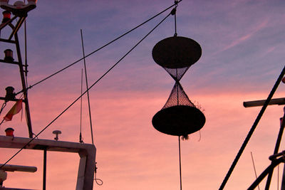 Low angle view of silhouette street light against sky at sunset