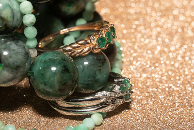 Natural emerald, beryl beaded bracelet, necklace and yellow gold ring.