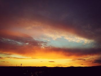 Silhouette of landscape against dramatic sky