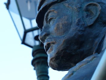 Low angle view of statue against blurred background