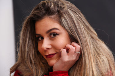 Close-up portrait of smiling young woman