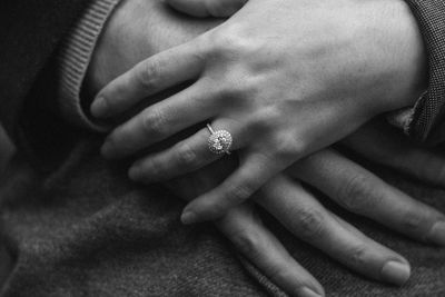 Close-up of woman hands with engagement ring