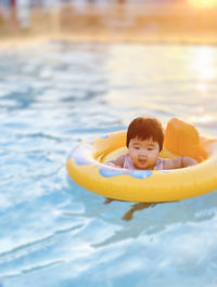 Young woman swimming in a pool