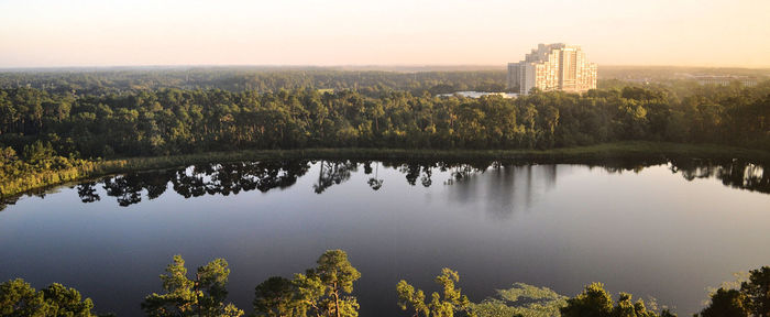 Reflection of trees in lake against sky