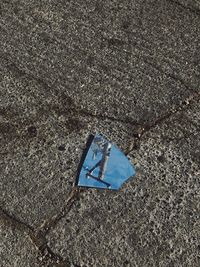 High angle view of broken mirror on street