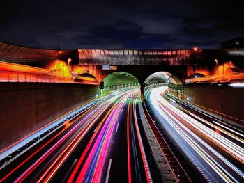 High angle view of light trails on road at night