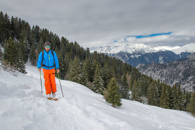 Man skiing on snow covered mountain