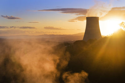 Scenic view of landscape against sky during sunset