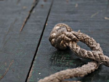 Close-up of rope on floorboard