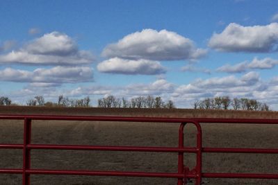 Scenic view of landscape against cloudy sky