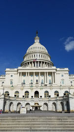 Low angle view of historical building against blue sky