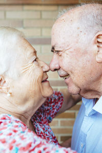 Senior couple rubbing noses