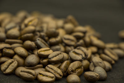 Close-up of coffee beans on table