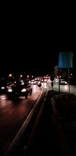 Traffic on road in city at night