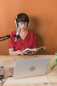 Senior woman narrates book during podcast