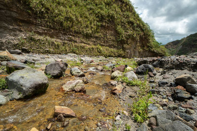 Surface level of stream flowing through rocks