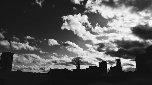 Low angle view of built structure against cloudy sky