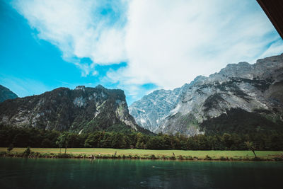 Scenic view of lake and mountains against sky