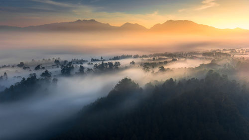 Scenic view of mountains against sky during sunset