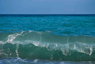 Scenic view of sea against blue sky