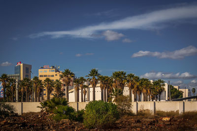 Buildings in city against sky