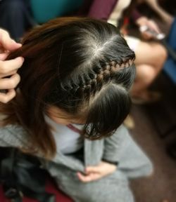 Person braiding hair