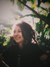 Portrait of smiling young woman outdoors