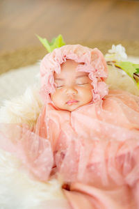 Beautiful baby girl wearing fantasy costume. fast asleep.