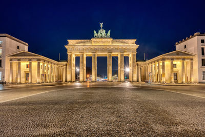 The illuminated brandenburg gate in berlin at night