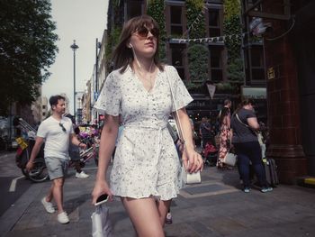 Women walking on street in city