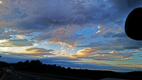 Scenic view of landscape against cloudy sky