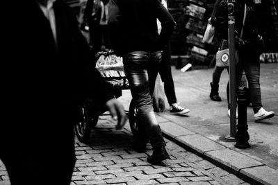 Woman walking on footpath