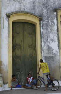 People sitting outside building