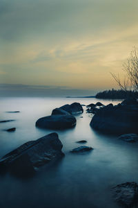 Scenic view of sea against sky at sunset