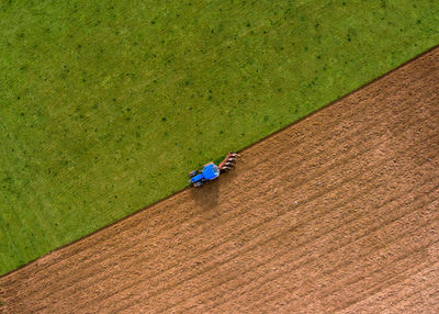 High angle view of agricultural machinery on field