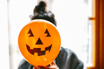 Close-up of illuminated pumpkin at home during halloween