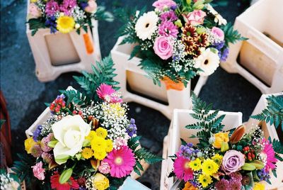 High angle view of colorful flower bouquets in pots